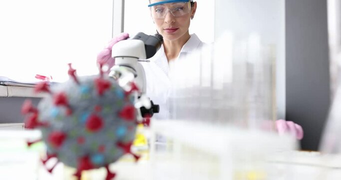 Doctor scientist measures microscopy of bacteria closeup