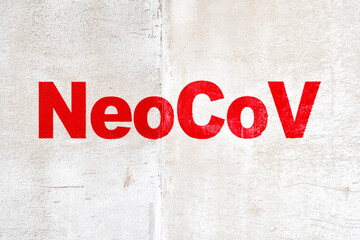 Wall with the inscription NeoCoV. A simple template with space for text on the topic of a new...