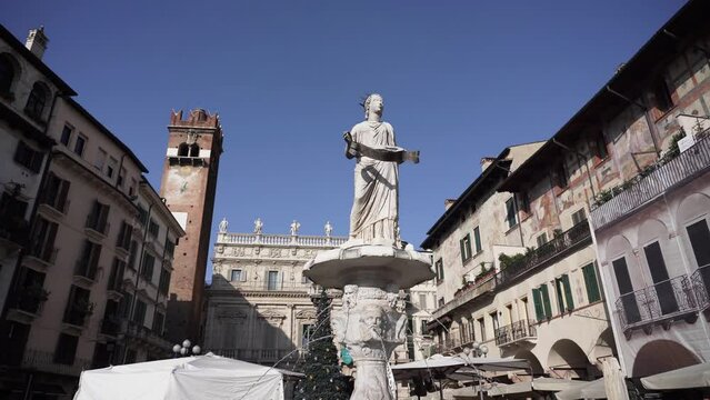 Madonna Verona fountain with ancient wall paintings in Piazza delle Erbe in Verona 4k