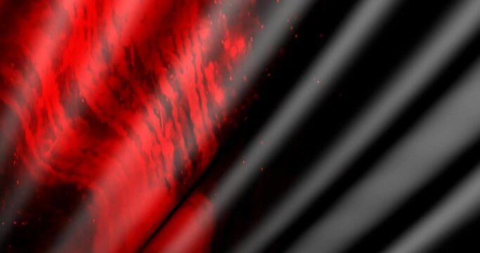 Fire on the movable fabric. Fabric in the wind decorated with flashes of red.