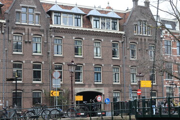 Amsterdam Kloveniersburgwal Street View, with Building Facade and Parked Bicycles, Netherlands