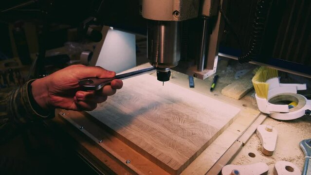 Worker Changes Drill Bit On Lathe
