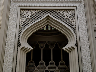 the outer gate of the mosque with arabic ornaments
