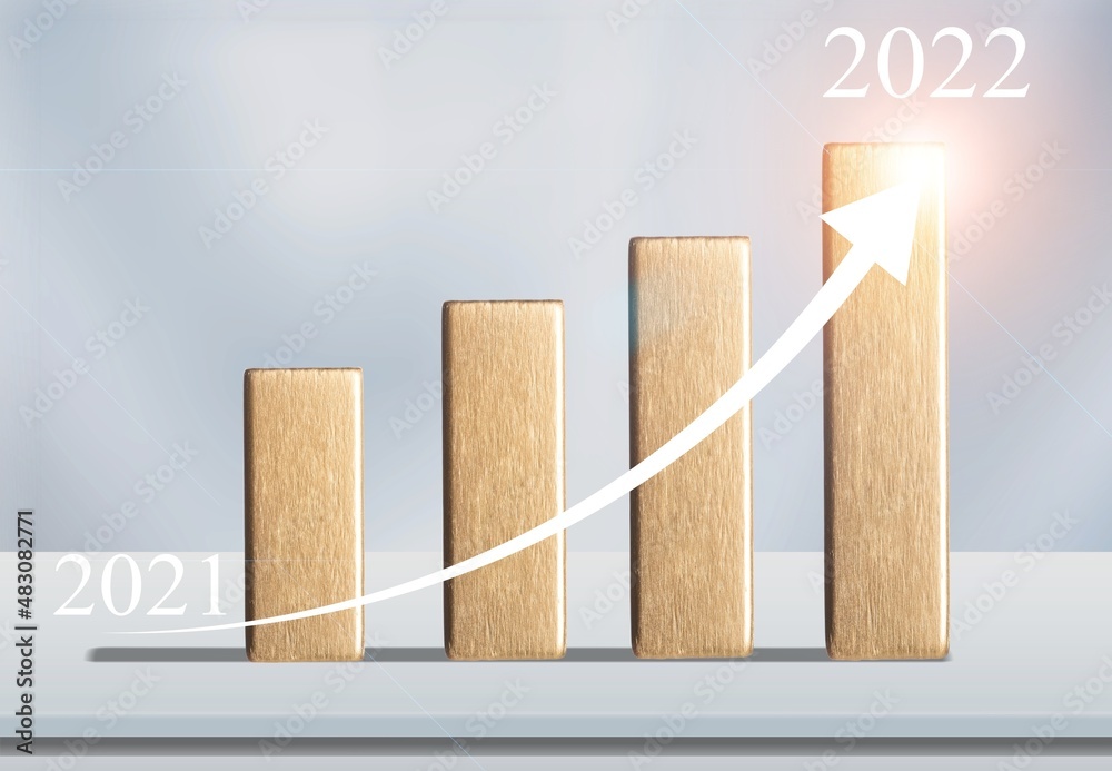 Wall mural shining rise up arrow on wooden blocks chart steps from the year 2021 to 2022. the business growth p