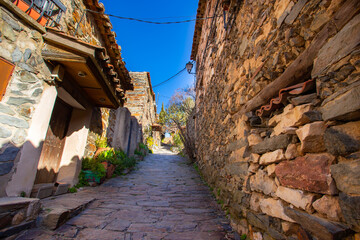 Stone-paved streets and terraced houses. Wrought iron decoration in the houses of the town of...