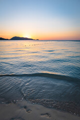 Patong Beach sunset in Phuket Island, the most popular beach in the resort town of Phuket island, Thailand.  Patong beach landscape for vacation, holiday, travel 
