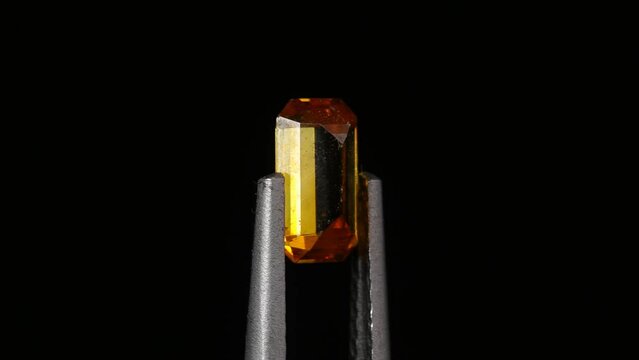natural yellow sphalerite on the turning table. black background