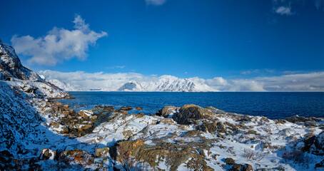 Panorama of Lofoten islands and Norwegian sea in winter with snow covered mountains. Lofoten islands, Norway