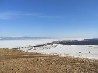 ground with snow against the blue sky