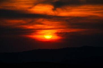 Amazing and dramatic red and orange sunset sky. Beautiful color nature landscape.