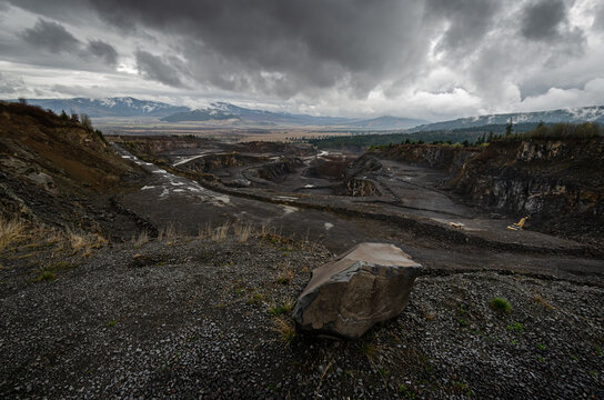 Stone quarry landscape on a cloudy day. Wide image with the stone pit from Liban, Harghita County in Romania.