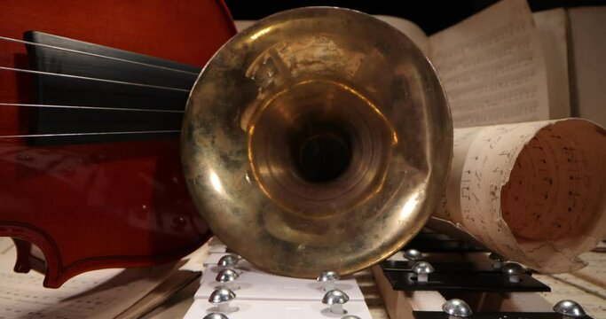 Musical instruments with sheet music on table. Music, musical instruments, orchestra, sheet music,