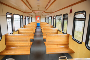 Empty train with wooden seats. Train to a North Sea island. train in Germany 