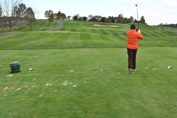Fototapeta premium Black golfer teeing off