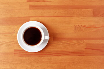 cup of coffee on wood table