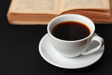 A cup of coffee and a book