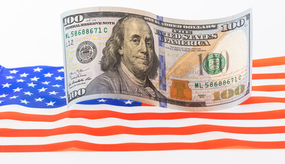 U.S. 100 dollar banknote on american flag background