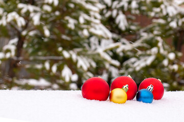 Christmas balls of snow with rays of the sun