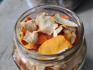 Homemade candied orange peel after the drying process. Dry orange peels in a ja