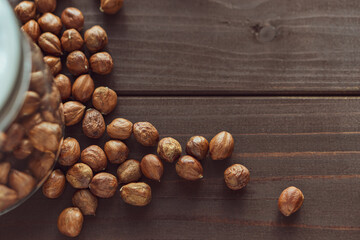 Close up brown hazel nut on wooden desk. Healthy organic snack hazelnut. Vegetarian nutrition.