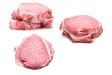 Raw pork pieces isolated on a white background.