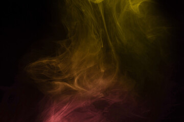 Yellow and pink steam on a black background.