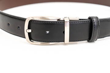 part of Double-sided black and brown leather belt on a white background.