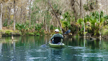 Fototapeta na wymiar Man paddling in a Kayak