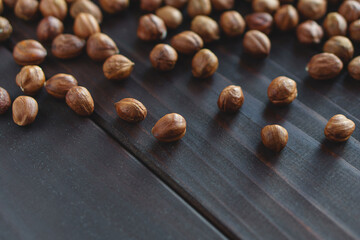 Close up brown hazel nut on wooden desk. Healthy organic vegetarian snack hazelnut. Place for text