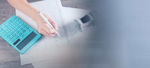 young woman counting on a calculator