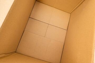 Open empty brown cardboard box background top view