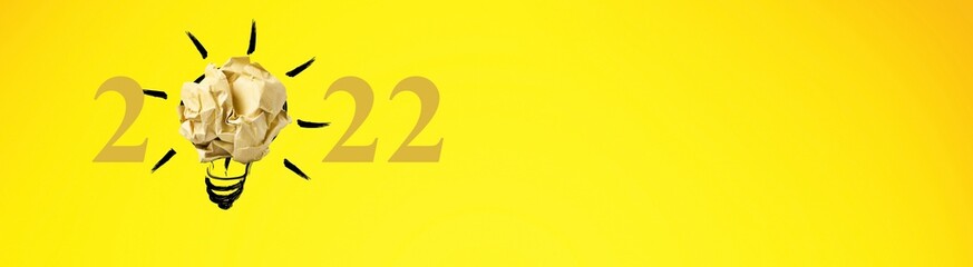 2022 creativity inspiration concepts with a light bulb on the background.