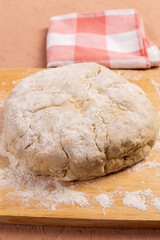 Flour and soft bread dough in bakery, close up. Vertical photo