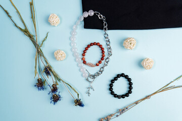 Different Bracelets made of natural stones on hand from natural stone Jasper. Handmade jewelry.