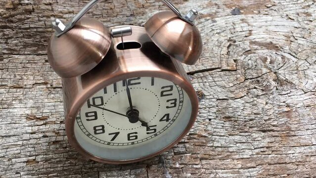 Turn back time. Alarm clock running backwards 