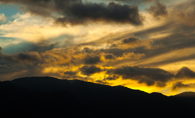 Silhouettes of the mountains on a sunshine.