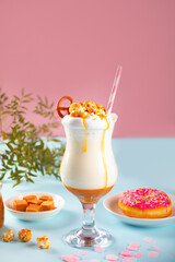 Milkshake with caramel syrup, popcorn and brezel waffles