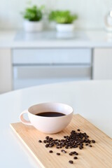 Black coffee in a white mug, Coffee beans