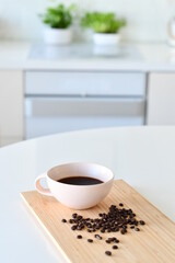 Black coffee in a white mug, Coffee beans
