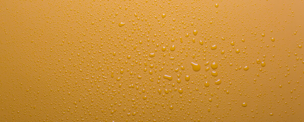Water drops on orange color  surface
