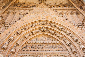 Fototapeta premium Bas-reliefs and sculptures on the facade of an antique building.