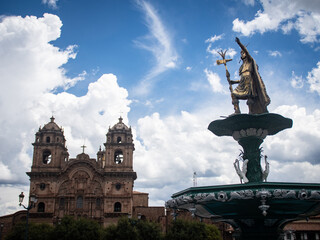 Fototapeta premium Inca statue and the church