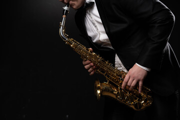 Saxophonist Musician in Black Tuxedo and Bow Tie Plays the Alto Saxophone. Alto Sax Player, Jazz...