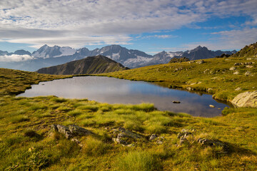From the Tonale lake view on Presanella top in windy morning, Passo del Tonale, Lombardy, Italy.