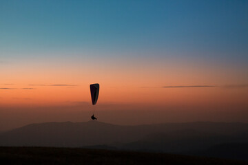 Pico do Gavião, Andradas, Minas Gerais, Brazil: sunset at the top of mantiqueira mountain with paraglaider flight