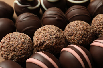 Many different delicious chocolate truffles, closeup view
