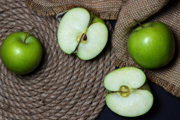 Green apples on a dark background. Fruit theme. fruit good for health