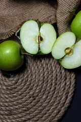 Green apples on a dark background. Fruit theme. fruit good for health