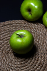 Green apples on a dark background. Fruit theme. fruit good for health