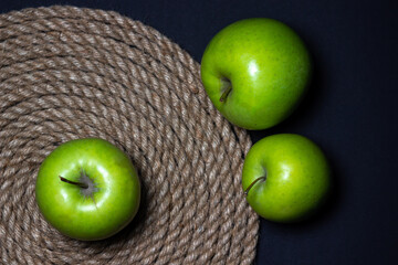 Green apples on a dark background. Fruit theme. fruit good for health